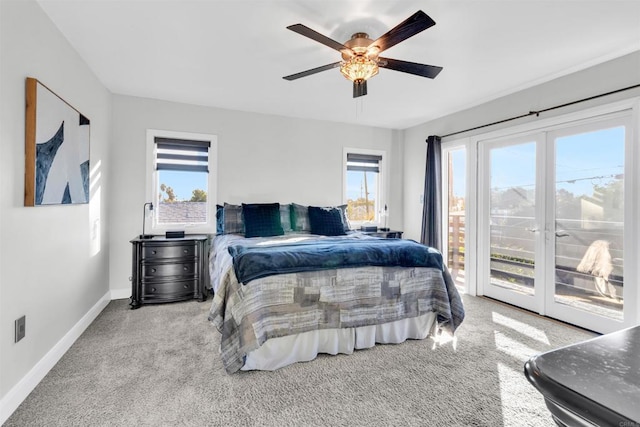 carpeted bedroom featuring ceiling fan, access to exterior, and multiple windows