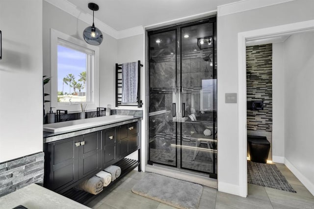 bathroom with an enclosed shower, vanity, and ornamental molding