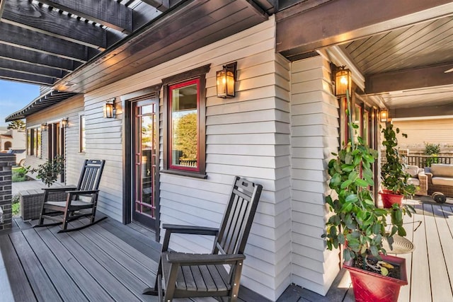 wooden terrace featuring covered porch