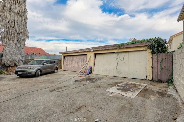 garage with fence