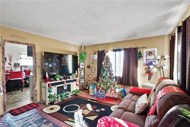 living area with a textured ceiling and light carpet