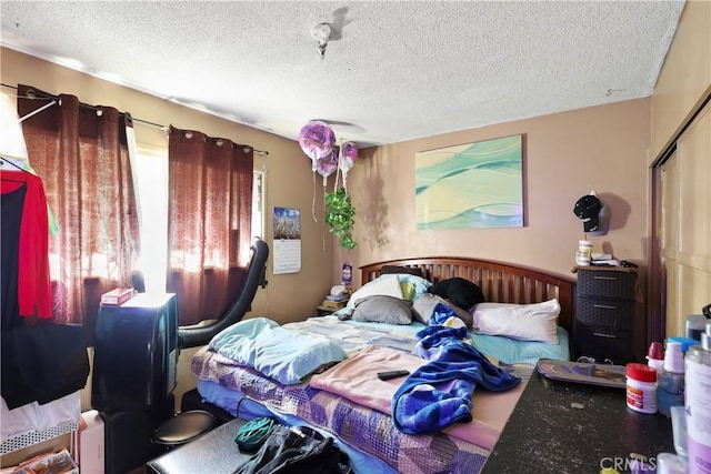 bedroom featuring a textured ceiling