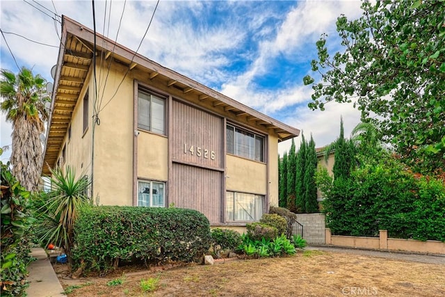 view of property exterior with stucco siding