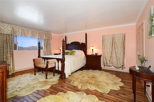 bedroom featuring hardwood / wood-style floors and crown molding