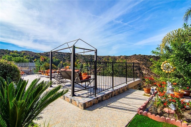 view of patio / terrace featuring a mountain view