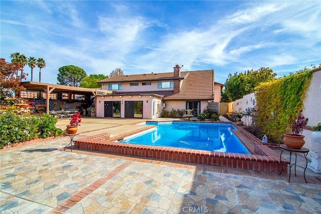 view of pool featuring a patio area