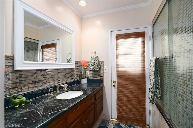 bathroom featuring vanity, crown molding, and backsplash