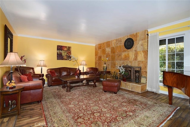 living room with tile walls, a tile fireplace, dark hardwood / wood-style floors, and ornamental molding