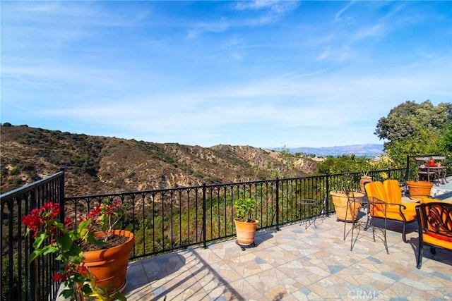 balcony featuring a mountain view