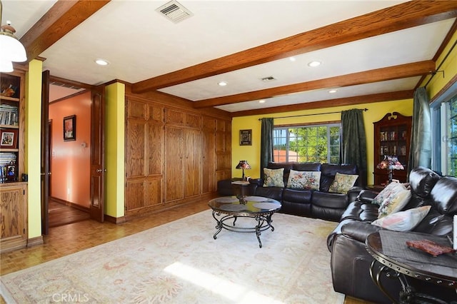 living room with beam ceiling