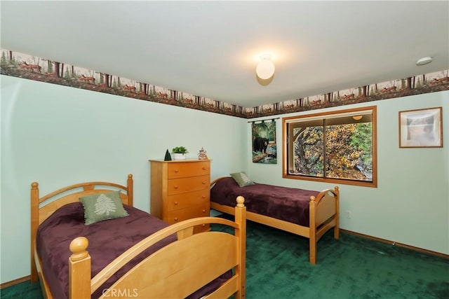 bedroom with dark colored carpet