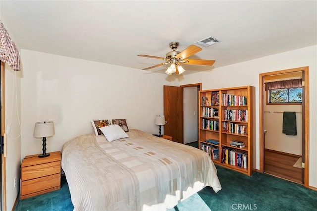 bedroom with dark carpet and ceiling fan