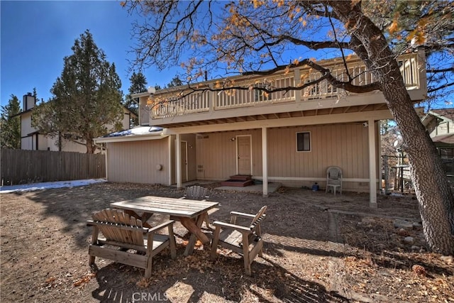 back of house featuring a deck