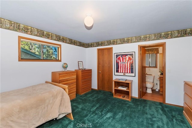 carpeted bedroom featuring ensuite bath