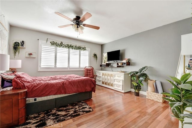 bedroom featuring ceiling fan and light hardwood / wood-style flooring