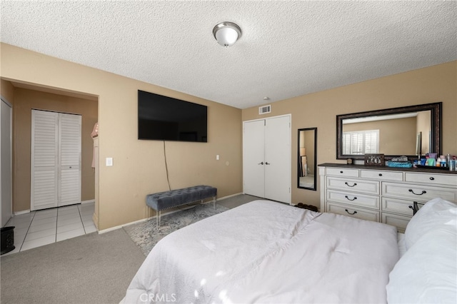 carpeted bedroom with a textured ceiling