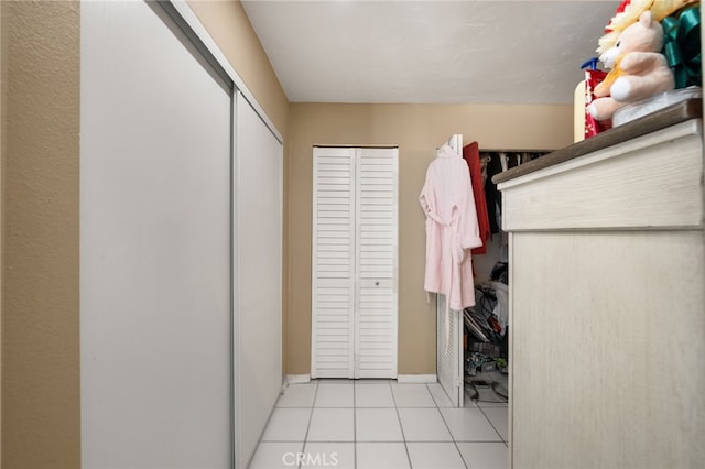 walk in closet featuring light tile patterned floors