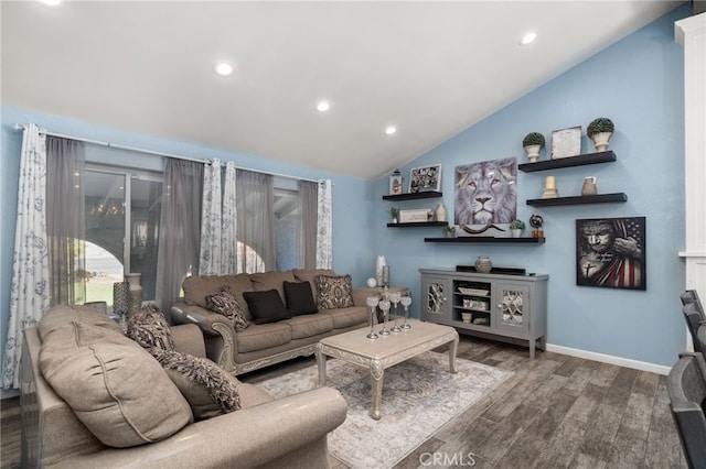 living room featuring wood-type flooring and vaulted ceiling