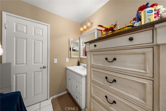 bathroom with tile patterned floors and vanity