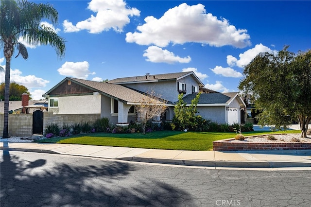 view of front of house featuring a garage and a front yard