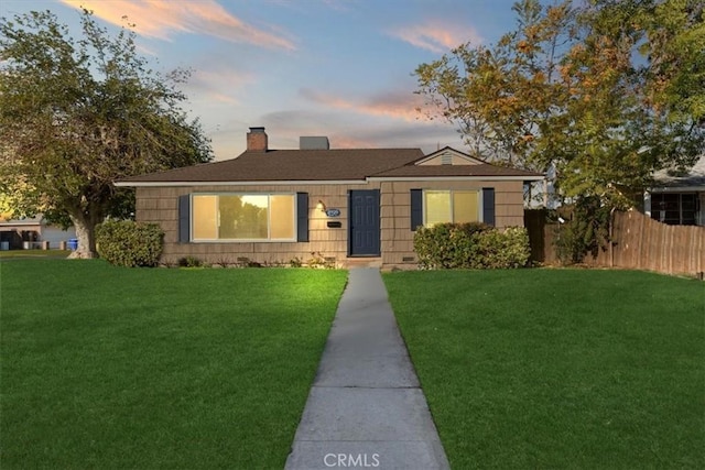 view of front of property with a lawn