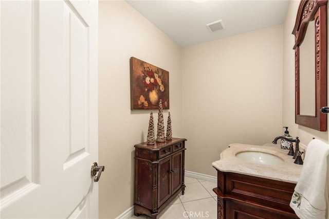 bathroom with tile patterned flooring and vanity