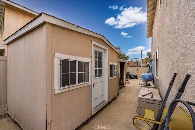 view of side of property with a patio