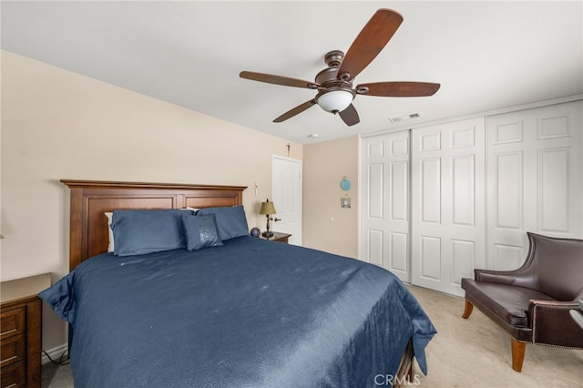 bedroom with ceiling fan and light colored carpet