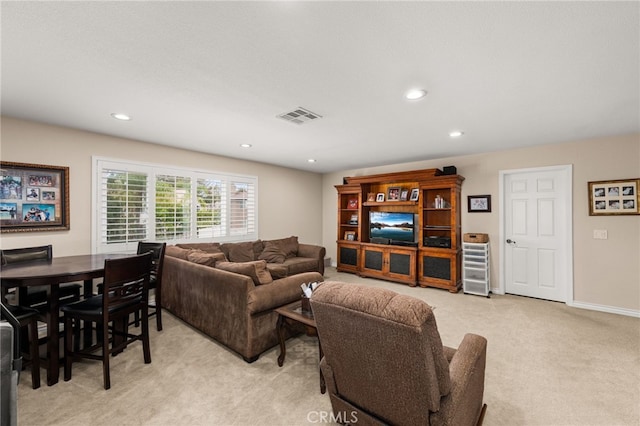 carpeted living room featuring a textured ceiling