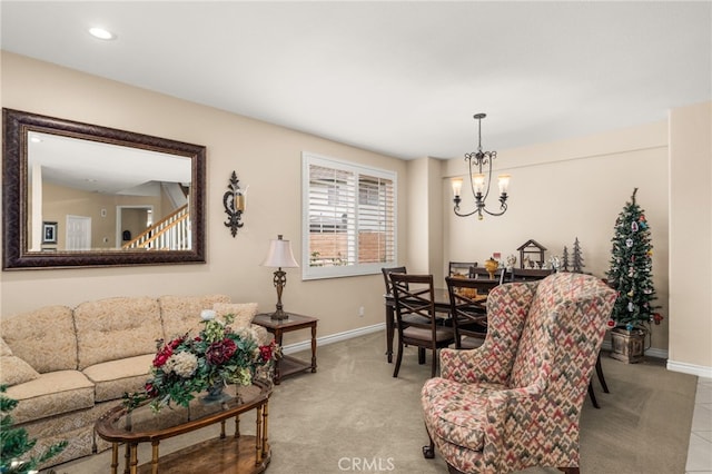 carpeted living room featuring a chandelier