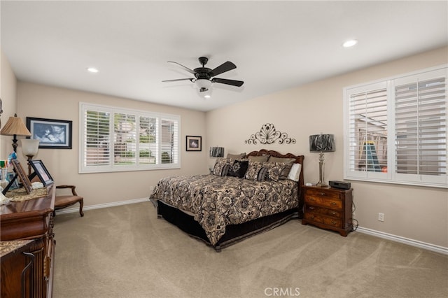 carpeted bedroom with ceiling fan