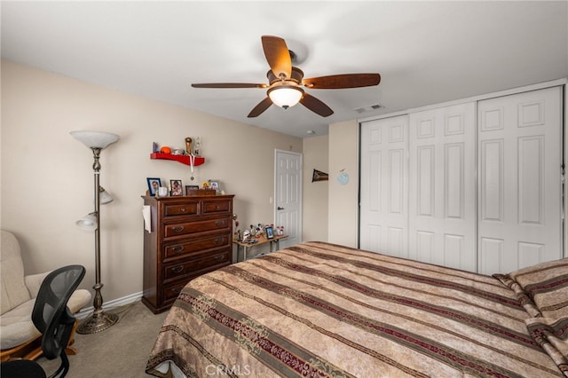 bedroom with carpet flooring, ceiling fan, and a closet