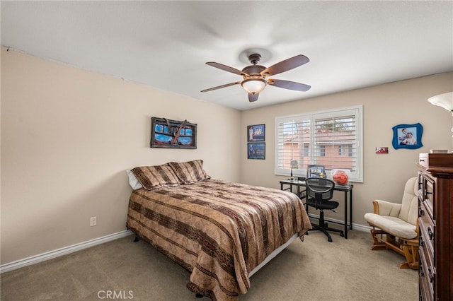 bedroom featuring ceiling fan and light colored carpet