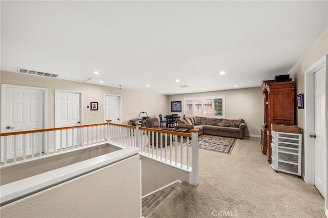 interior space featuring light carpet and beverage cooler