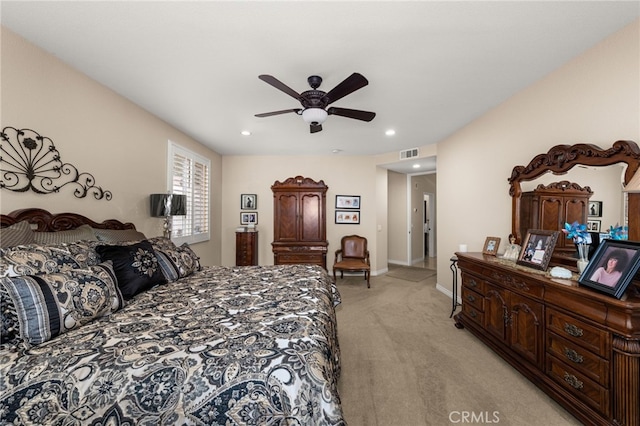 bedroom featuring light carpet and ceiling fan