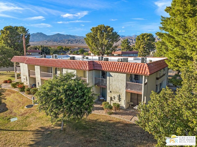 view of building exterior featuring a mountain view