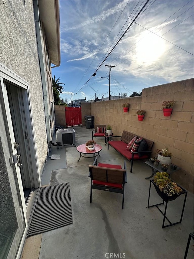 view of patio featuring cooling unit and an outdoor hangout area