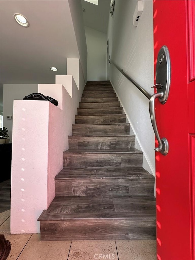 staircase featuring recessed lighting