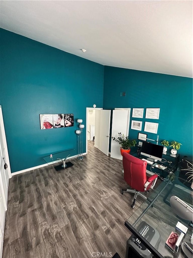 home office with wood finished floors and lofted ceiling