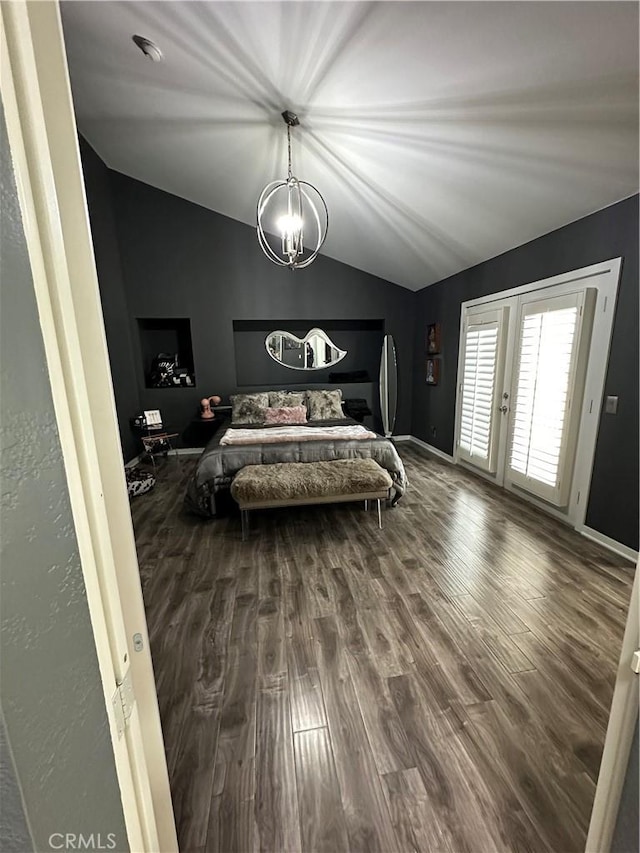 bedroom with baseboards, a notable chandelier, wood finished floors, vaulted ceiling, and french doors