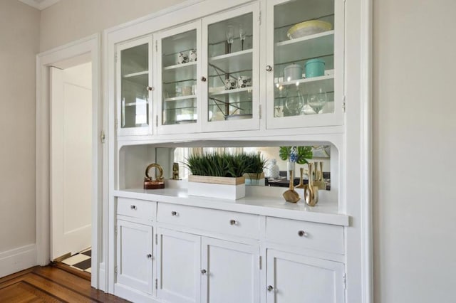 bar featuring white cabinets