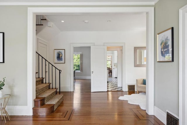 entryway with dark hardwood / wood-style floors