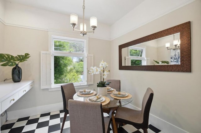 dining area with an inviting chandelier