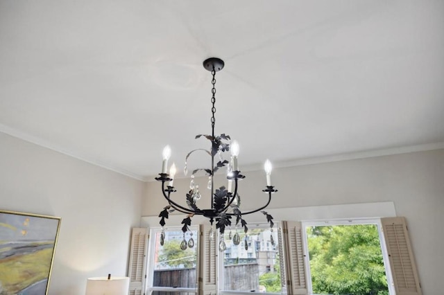 interior details featuring a notable chandelier and ornamental molding