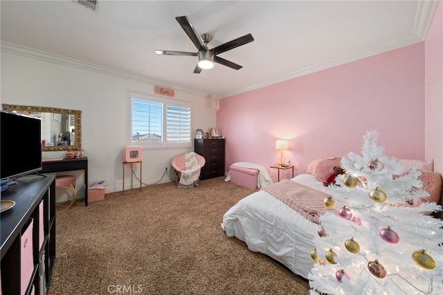 carpeted bedroom featuring ceiling fan and ornamental molding