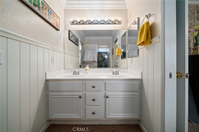 bathroom with wooden walls, vanity, and ornamental molding