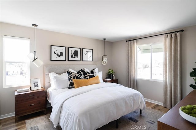 bedroom with hardwood / wood-style flooring