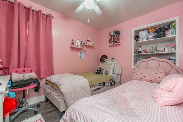 bedroom featuring ceiling fan and wood-type flooring