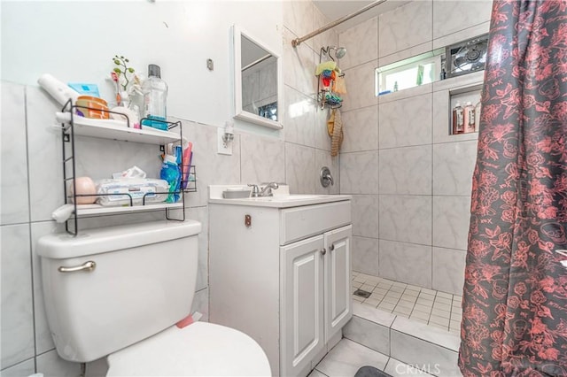 bathroom with tile patterned flooring, toilet, tile walls, and walk in shower