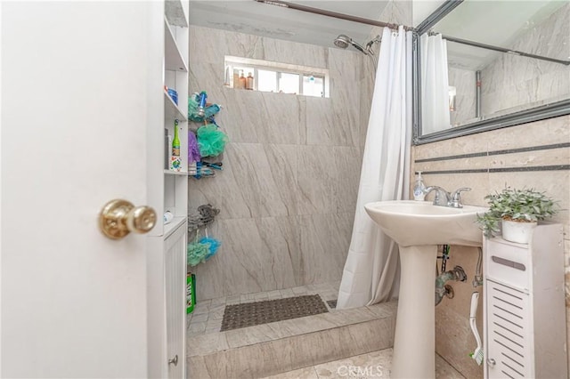 bathroom with tile patterned floors and curtained shower